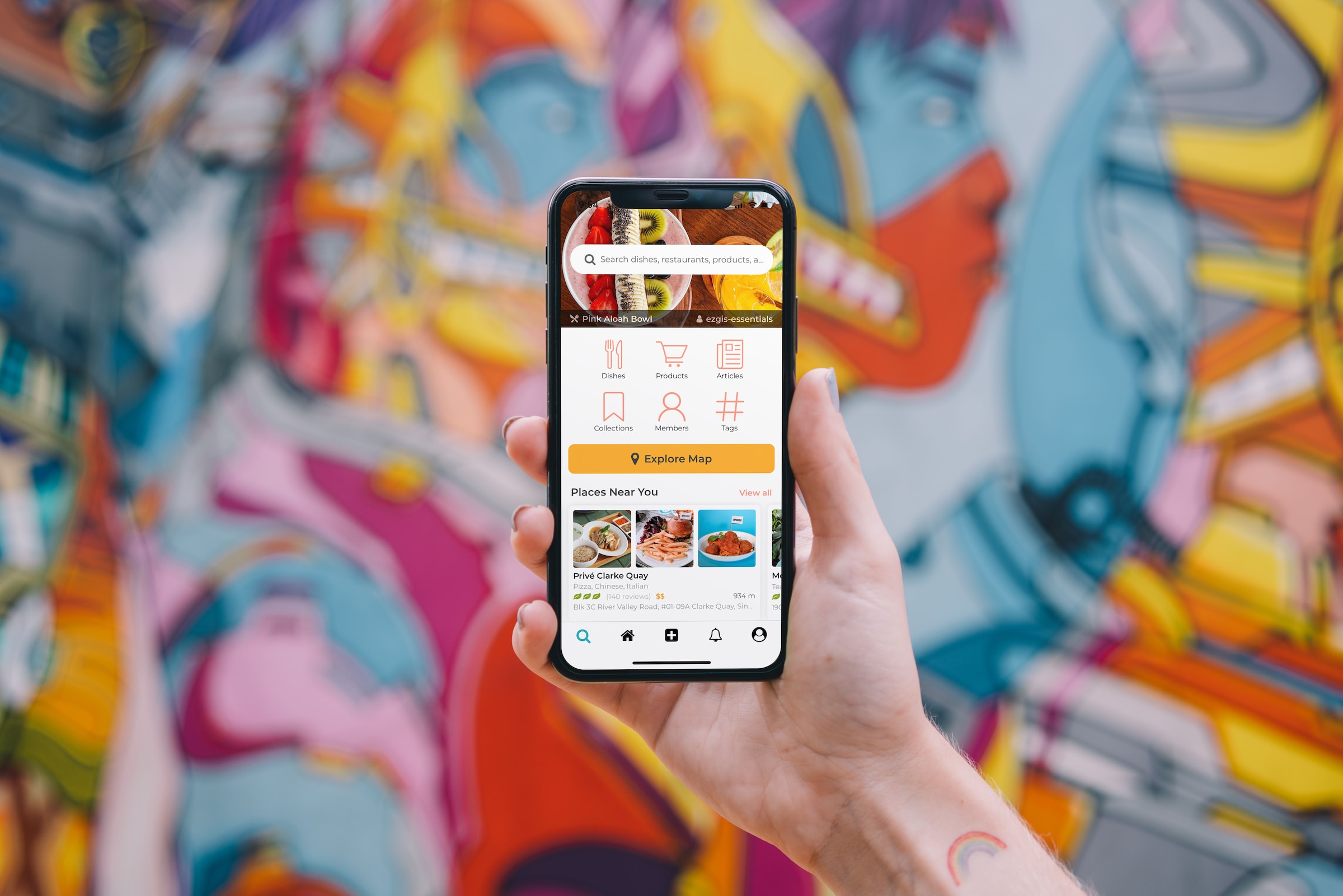 A mobile app with a colorful mural in the background